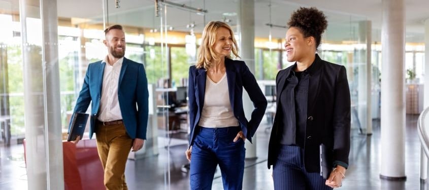 colleagues walking in an office