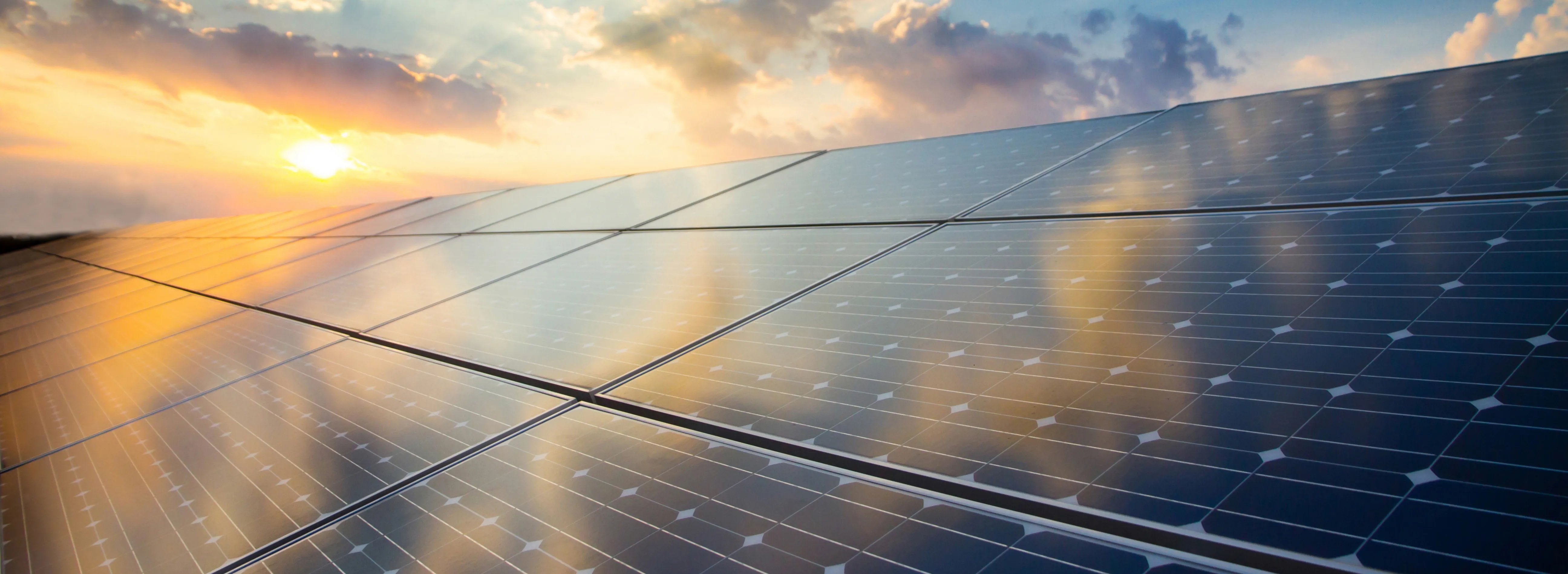 solar roof with sunset in the background