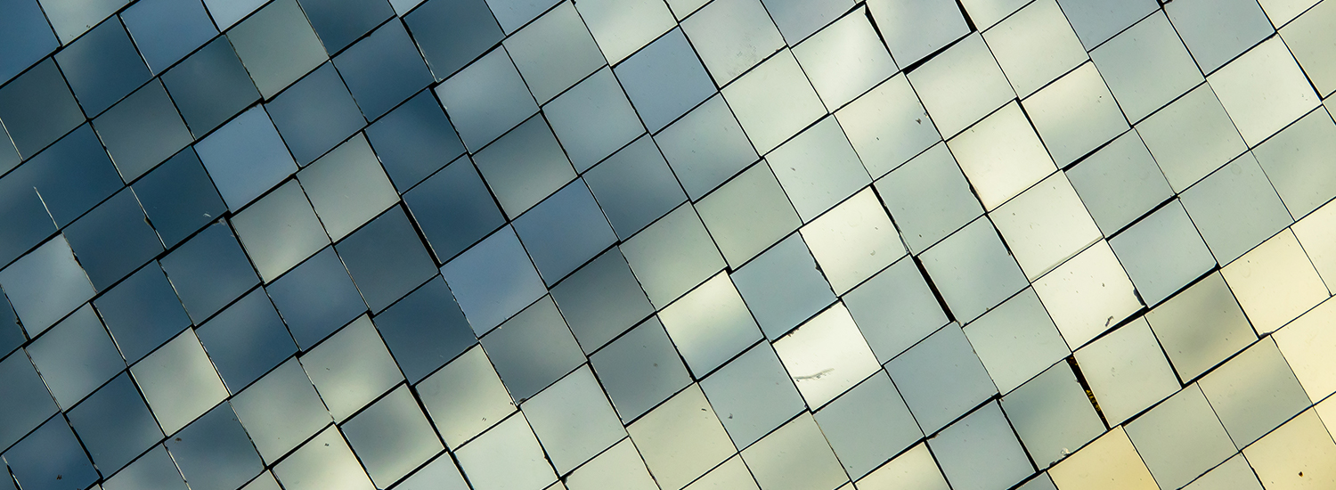 Small mirror decorated on wall background with reflection