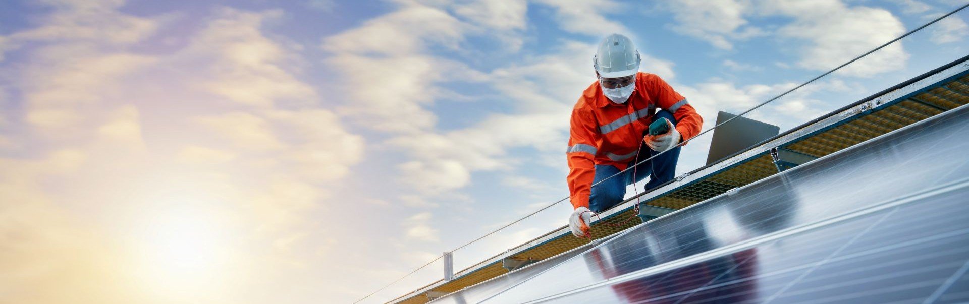 man installing solar panels