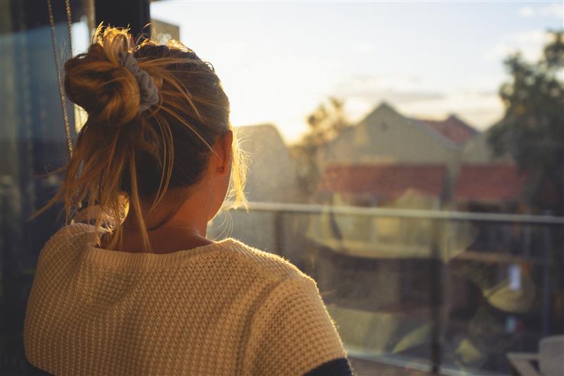 woman looking outside